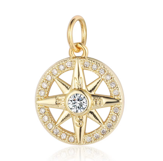 Gold compass charm with a sparkling crystal center, perfect for necklaces and bracelets