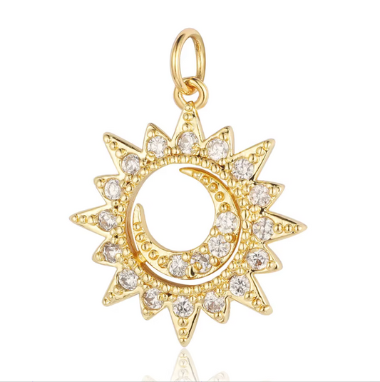 Gold sun and moon charm with sparkling crystals, perfect for celestial-themed jewelry.